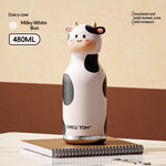 Cow-shaped thermos with 'Chicu Tom' branding on a beige background