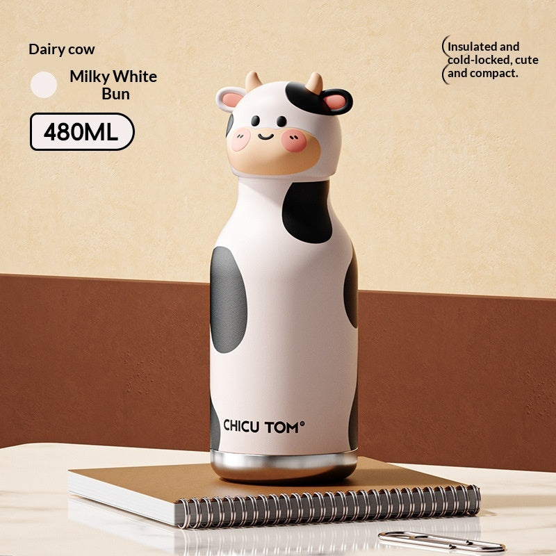 Cow-shaped thermos with 'Chicu Tom' branding on a beige background
