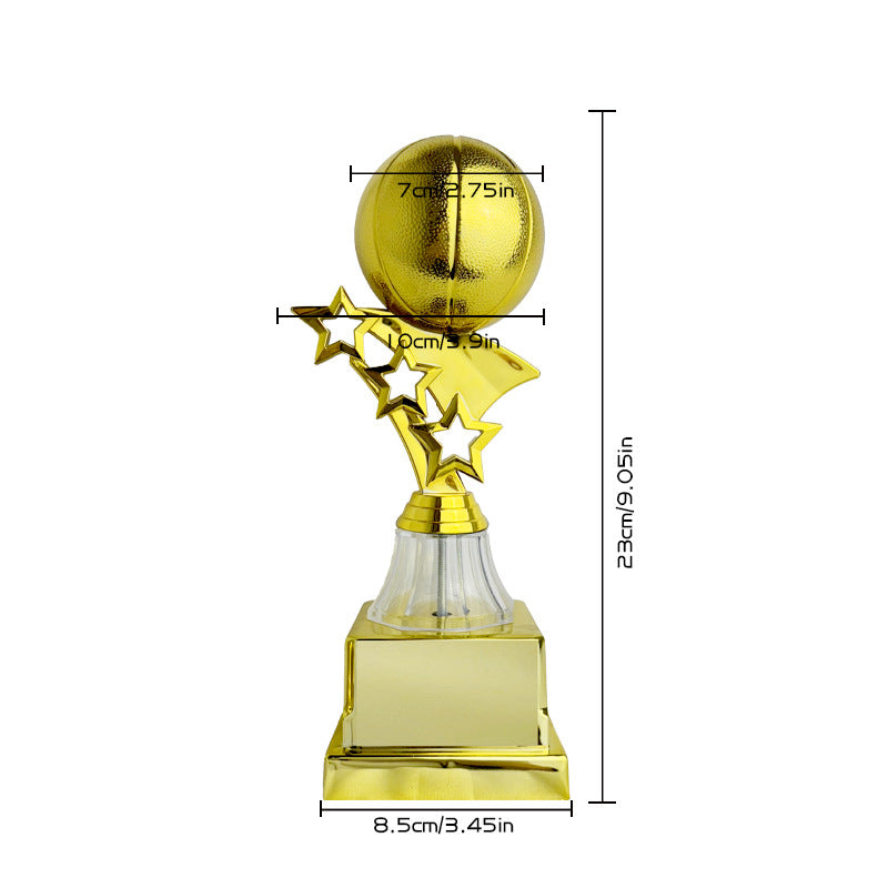 A gold trophy with a basketball-shaped top, star-shaped accents, a clear glass neck, and a rectangular base on a white background, with dimension lines and measurements shown.