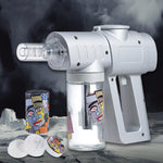 White handheld device with colorful canisters on a dark background