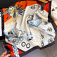 Colorful scarf with artistic designs on a surface