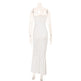 Mannequin wearing a polka dot dress on a white background