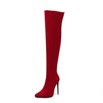 Red knee-high boot with a high heel on a white background