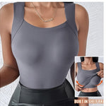 Gray tank top with built-in shelf bra worn by a person, on a light gray background.