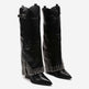 Black knee-high boots with studded details on a white background