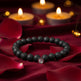Black beaded bracelet on a white background