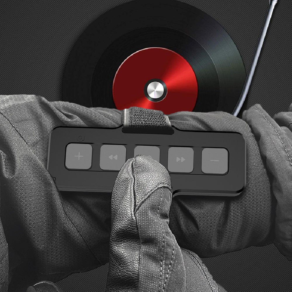 Hand wearing a glove interacting with a control panel over a vinyl record