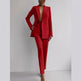 Red suit worn by a person on a plain background