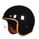 Black motorcycle helmet with brown interior on a white background
