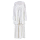 White pleated dress with a bow detail on a white background