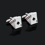 Cufflinks with playing card design on a black background