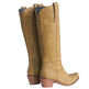 Tan knee-high boots with studded details on a white background