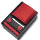 Red patterned tie set with tie clip and cufflinks in a black box on a white background