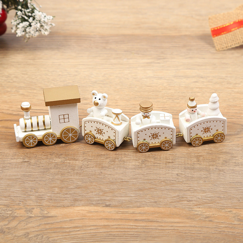 Wooden toy train set with teddy bear figures on a wooden surface