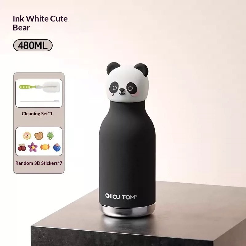 Black panda-shaped water bottle with cleaning set and stickers on a light background