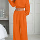 Person wearing an orange outfit in a bedroom setting