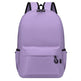 Purple backpack with black straps on a white background