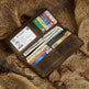 Brown leather wallet with multiple cards on a textured fabric background