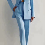 Light blue suit worn by a person on a plain background