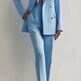 Light blue suit worn by a person on a plain background