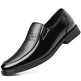 Black leather dress shoe on a white background