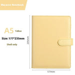 Yellow notebook with dimensions and product name on a white background