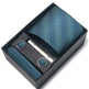 Teal tie set with matching pocket square, tie clip, and cufflinks in a black box on a white background.