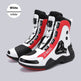 White, red, and black high-top shoes on a gray background