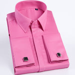 Folded pink dress shirt with cufflinks on a light gray background