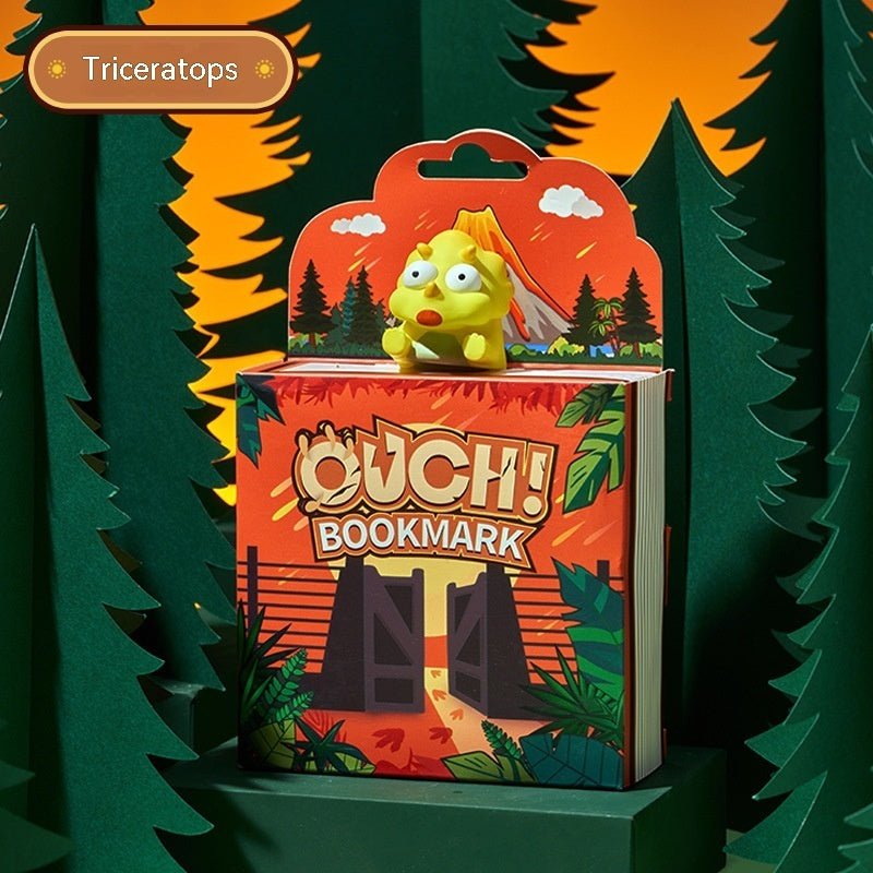 Bookmark with a cartoon character in a forest setting, labeled 'Triceratops'.