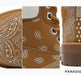 A three-panel close-up collage of a brown suede boot with white paisley bandana-style print details, including the side profile, lace area, and heel, on a white background with the text 'PARADIGM SHIFT' at the bottom right.